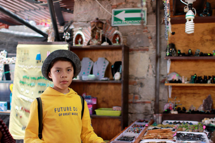 Portrait of boy looking at store
