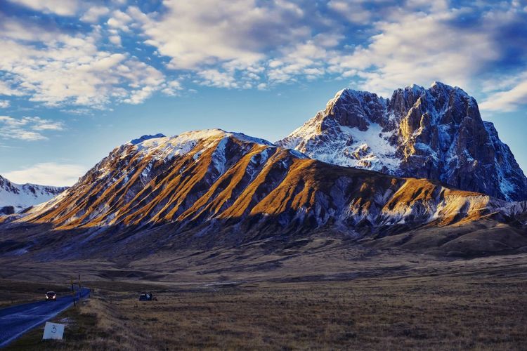 Scenic view of snowcapped mountains against sky