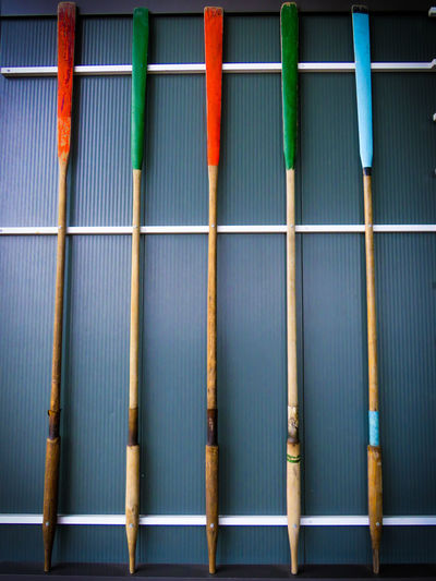 Full frame shot of multi colored arrows on rack