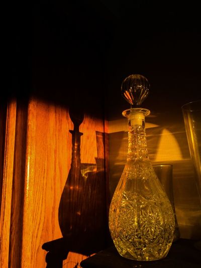Illuminated lamp post at night