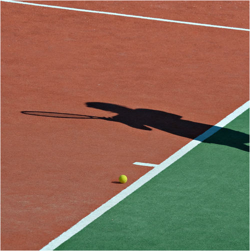 Shadow of person at tennis court