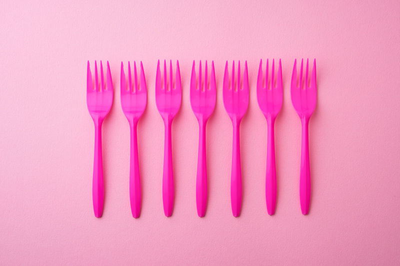 Close-up of pink candies against white background