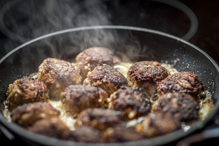 Close-up of meat cooking in pan