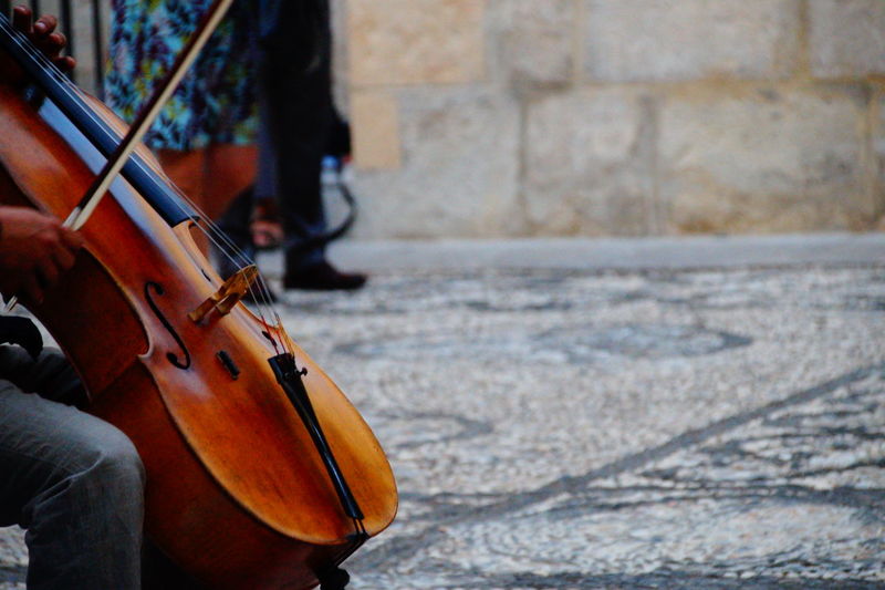 Man playing cello on street
