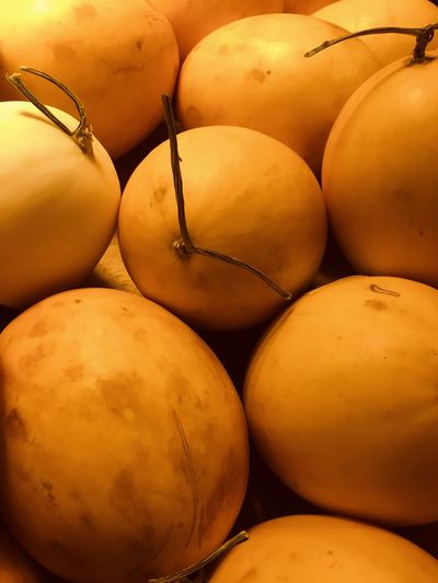 Close-up photo of fresh orange honeydew melons on local grocery store