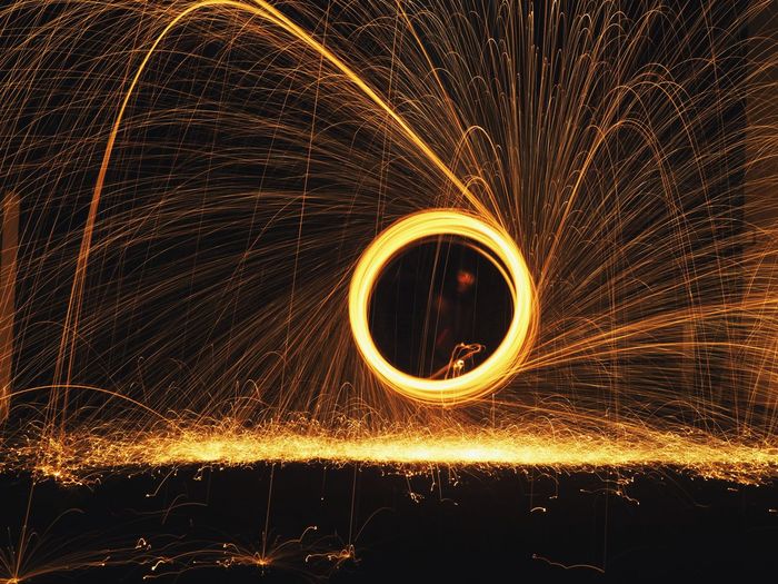Full frame shot of illuminated light painting at night