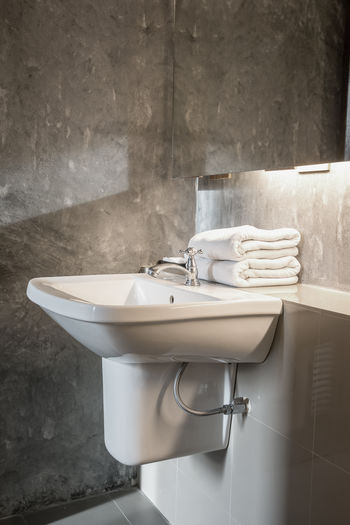 Close-up of faucet in bathroom
