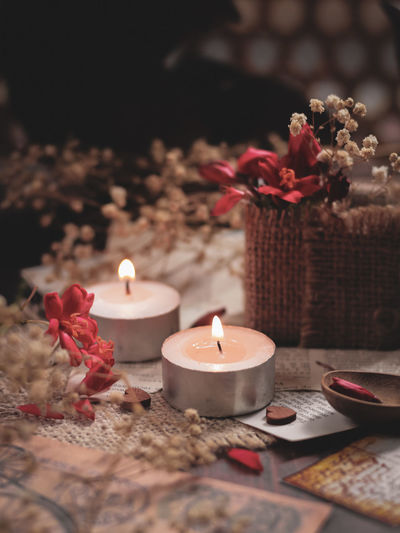 Lite candles with flowers. stilllife concept