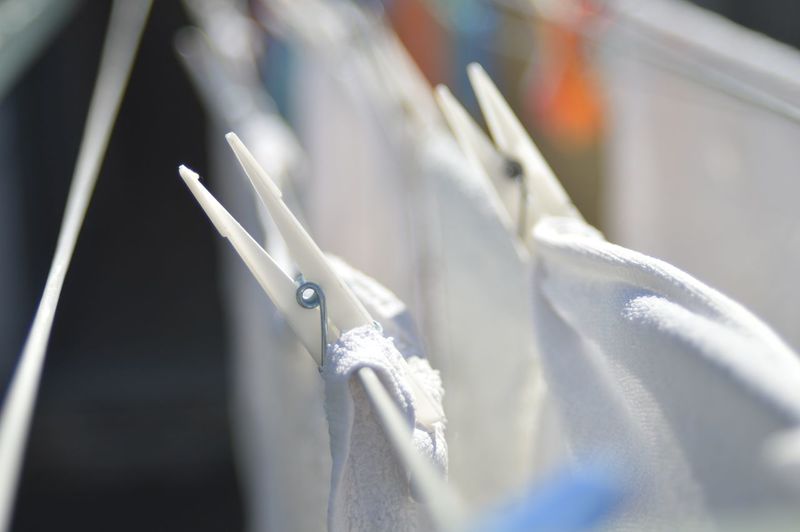 Close-up of towels drying on clothesline