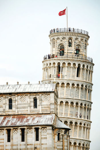 Low angle view of leaning tower of pisa against clear sky