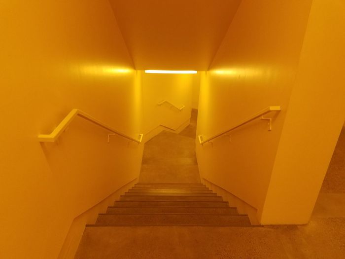 Staircase in illuminated corridor