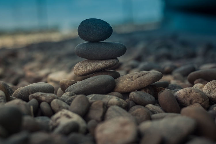 Few stones stacked in a pile on a blurry background. esoteric concept image. 