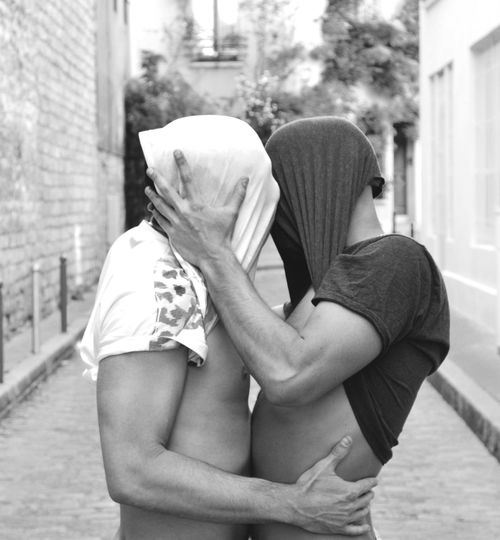 Gay couple embracing on street