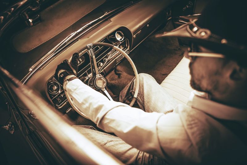 Man driving vintage car