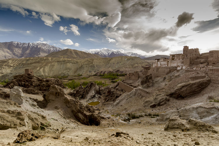 View of desert against cloudy sky