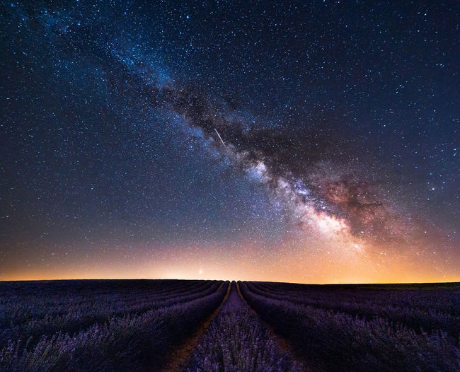 Scenic view of star field against sky at night