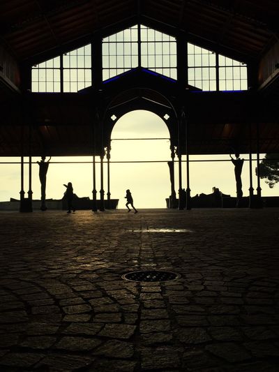 Silhouette people in city