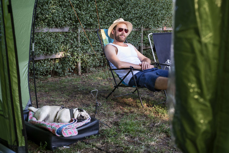 Man relaxing on campsite