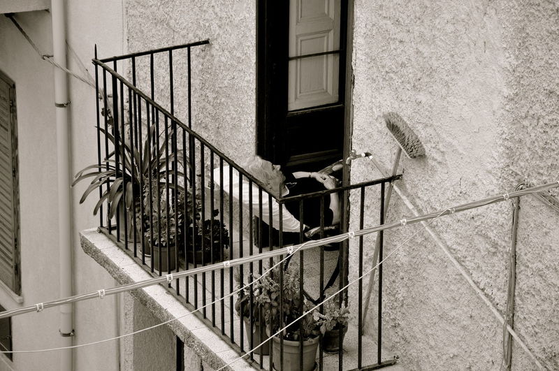 High angle view of senior woman resting on balcony