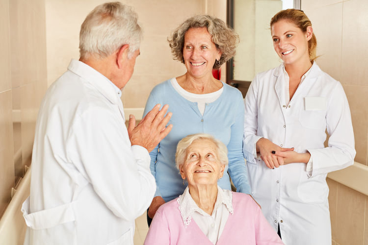 Nurse with senior people at nursing home