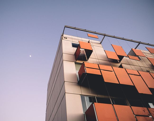 Low angle view of building against clear blue sky