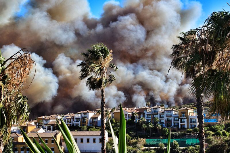 Panoramic view of city with smoke from bush fires in the background