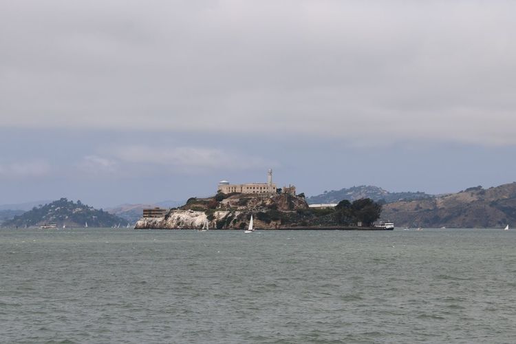 View of alcatraz island against cloudy sky