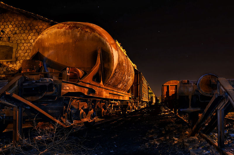 Abandoned train against sky at night