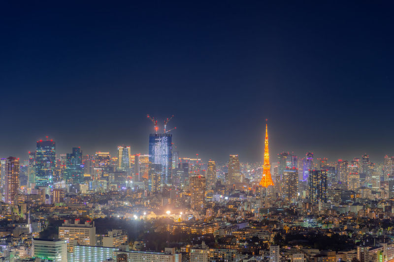 Illuminated buildings in city at night