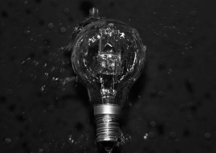 High angle view of water pouring on light bulb