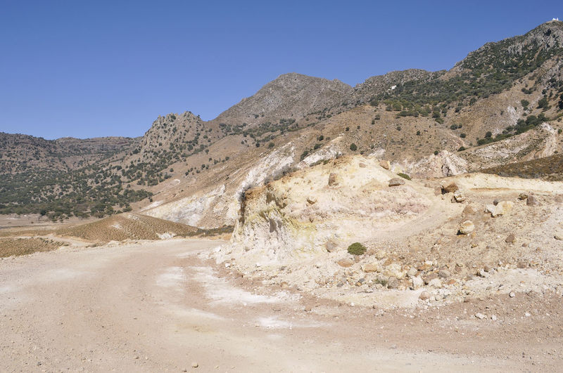 Landscape with mountain range in background