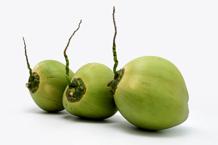 Close-up of fruits against white background