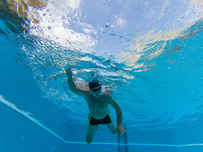 Man swimming in pool