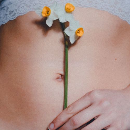 Close-up of woman hand holding flowers