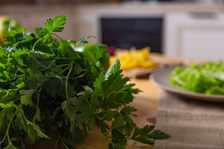 Fresh farmers tomatoes and basil on wood table.