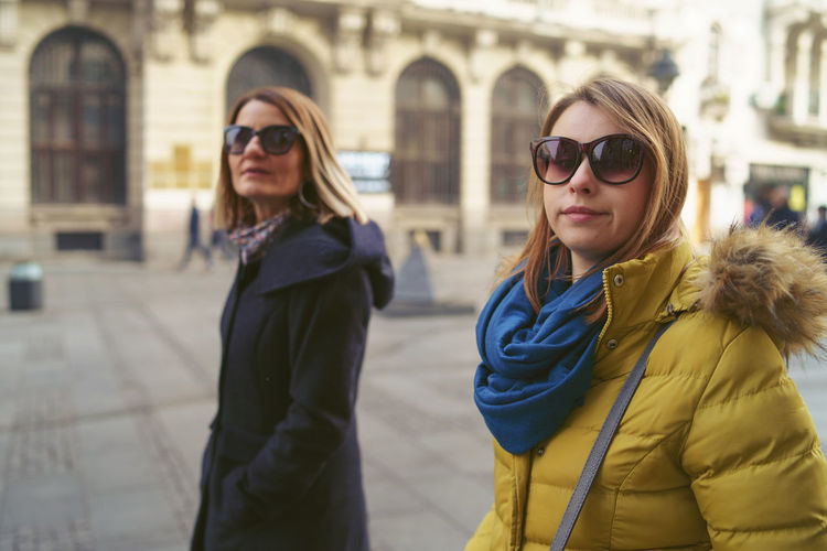 Women wearing sunglasses in city