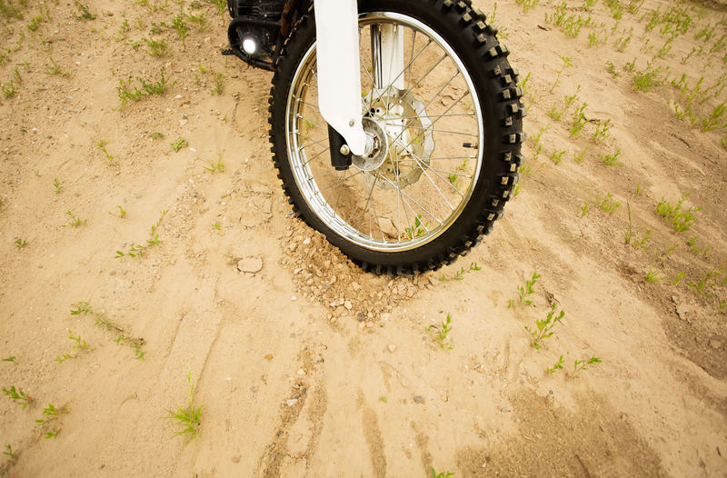 High angle view of bicycle on dirt road