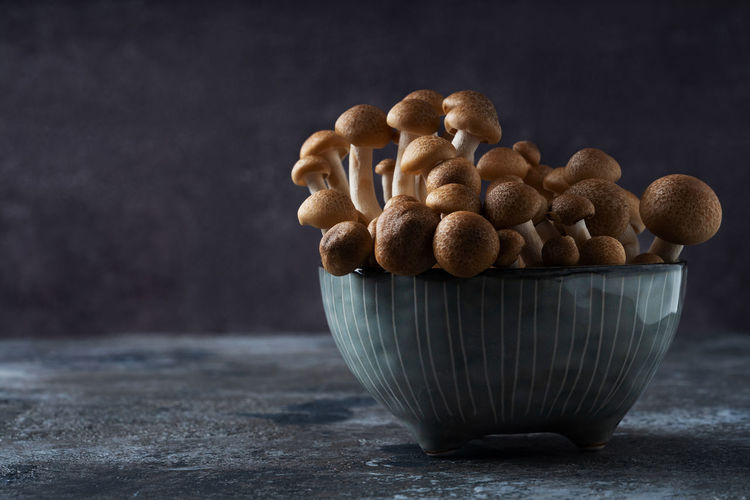 Close-up of mushrooms in bowl on table