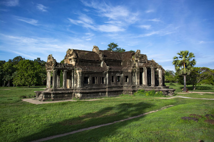 Temple building against cloudy sky