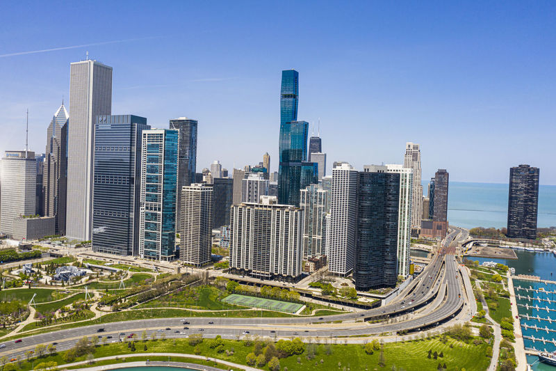 Panoramic shot of modern buildings against clear sky