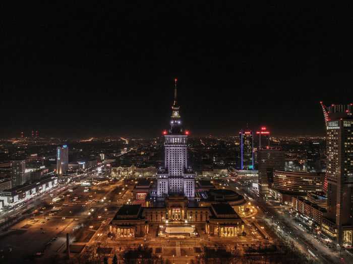 Illuminated buildings in city at night
