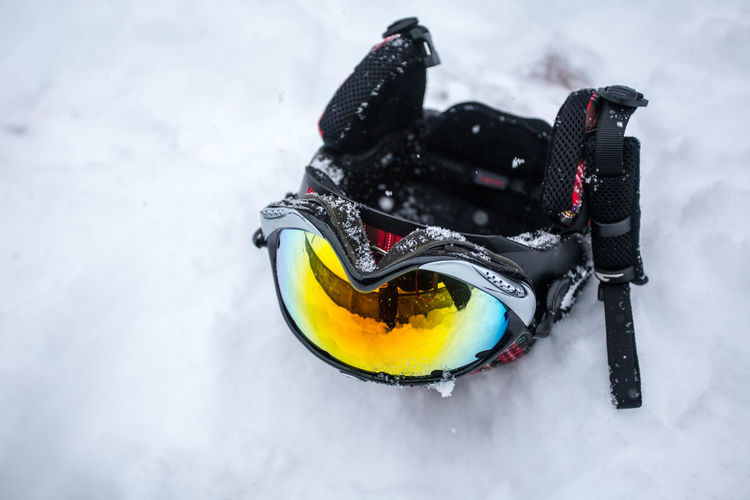 High angle view of skiing helmet on snow