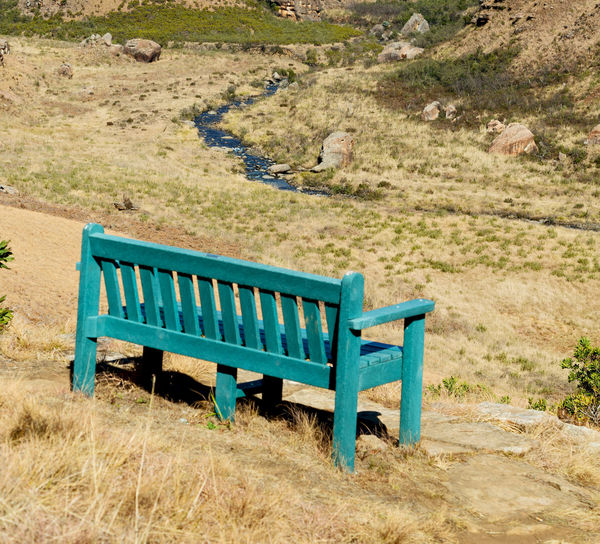 Empty bench on field