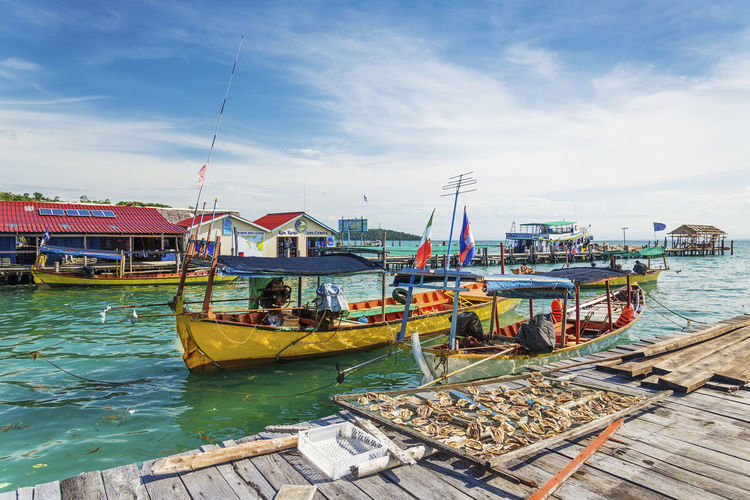 Boats moored at harbor