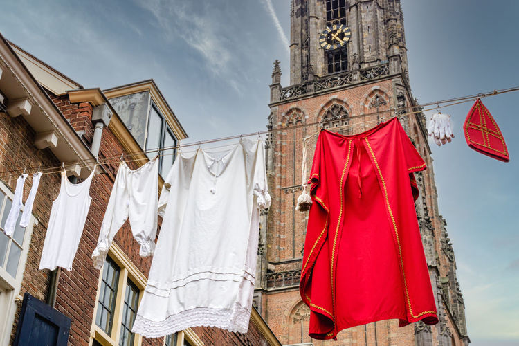 Sinterklaas clothes hanging to dry with church tower in background