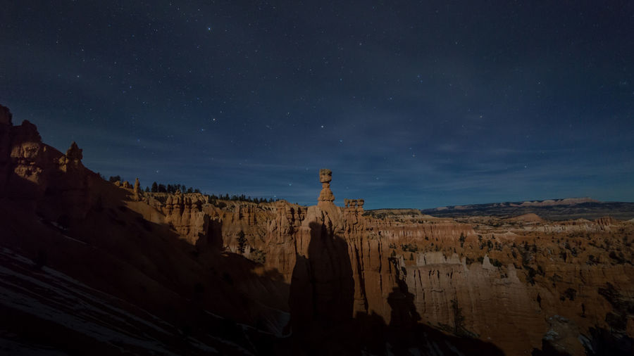 Panoramic view of rock formations at night