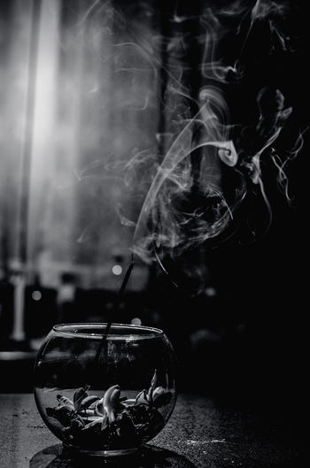 Close-up of smoking on table