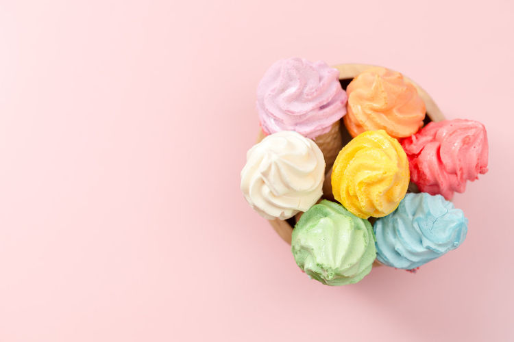 Directly above shot of multi colored candies against gray background