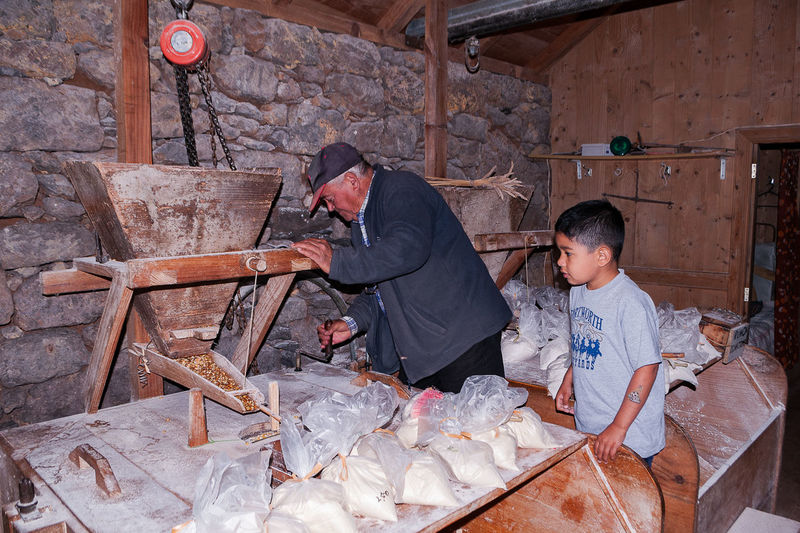 Man and boy at flour mill