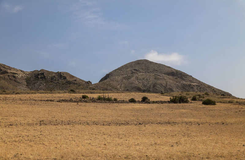Scenic view of landscape in cabo de gata nature park, spain, against clear sky in summer